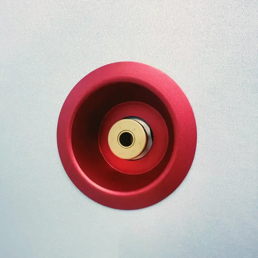 Close-up of a red and gold ventilation fitting for the KOMJET Anti-Aging Cabin 2.0 hyperbaric oxygen chamber.