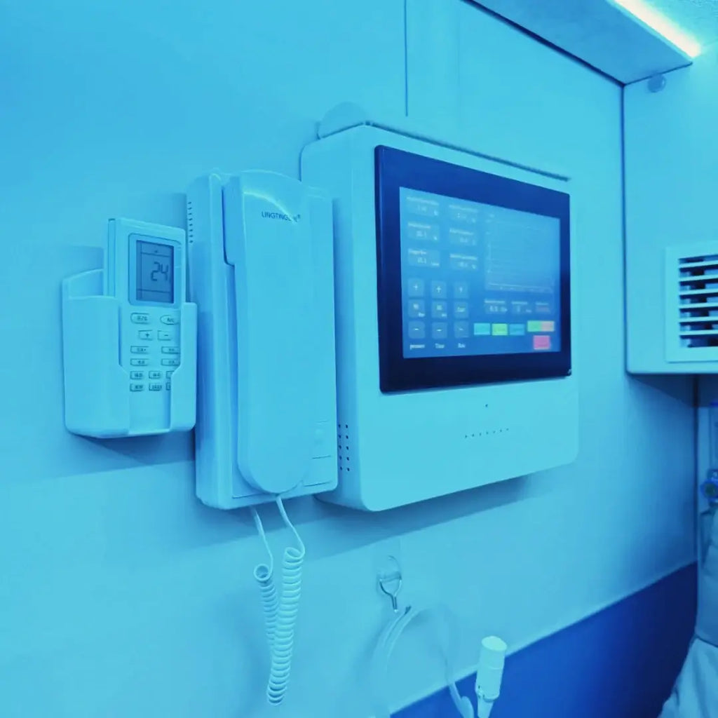 Interior view of the KOMJET Anti-Aging Cabin 2.0 showing control panel and intercom system.