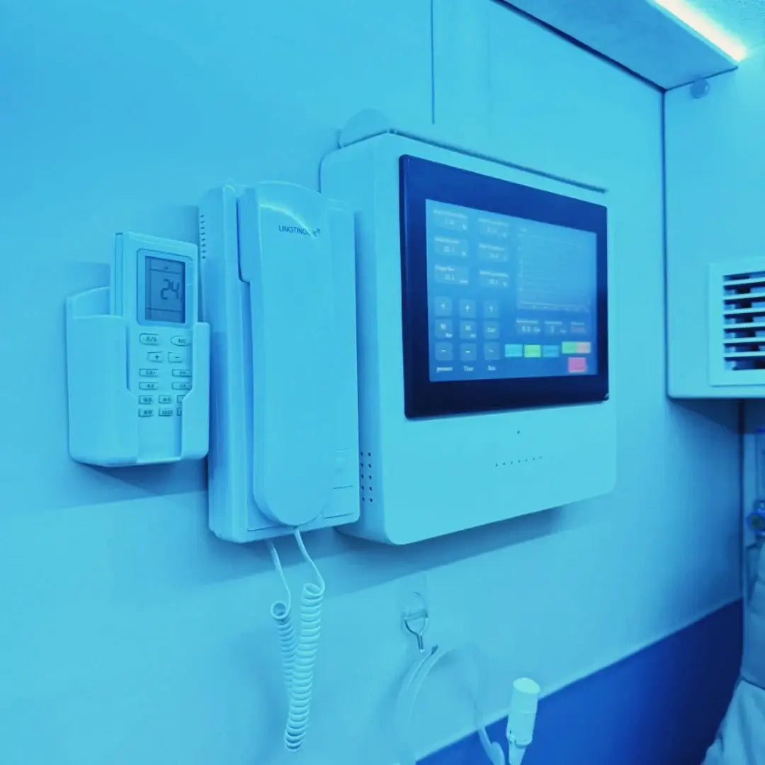 Interior view of the KOMJET Anti-Aging Cabin 2.0 showing control panel and intercom system.